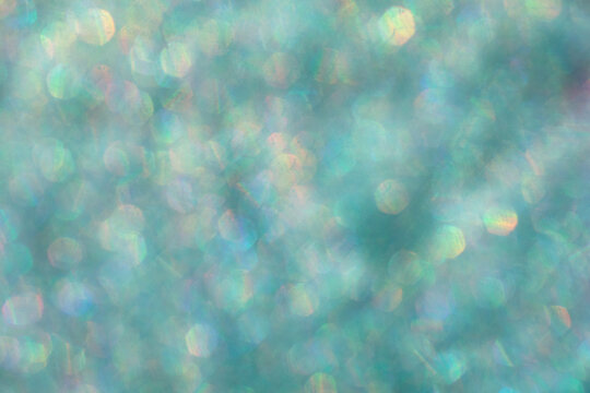 Abstract defocused blue background with shining glitter.Good as overlay layer.Abstract defocused background with shining glitter.