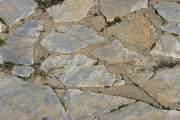 path in the yard made by hand from stones of various shapes.close up