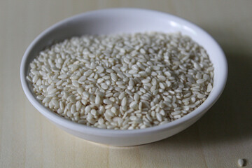 White sesame seed on the small bowl