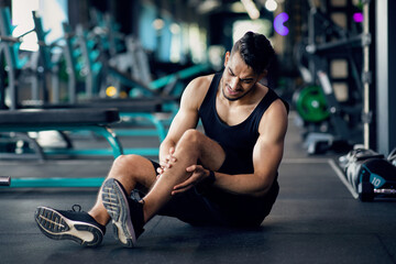 Sport Injury. Arab Male Athlete Suffering Knee Trauma While Training At Gym