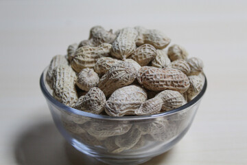 Roasted peanut on a transparent bowl