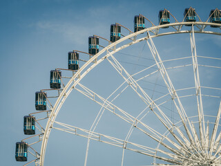 Part of a Ferris Wheel with blue sky