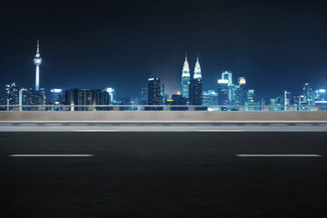Motion blur effect, side angle of highway overpass with city skyline background. Night scene .