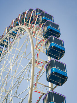 Part of a Ferris Wheel with blue sky