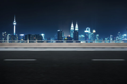Motion blur effect, side angle of highway overpass with city skyline background. Night scene .