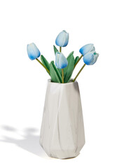 Subject shot of a graceful bouquet of tender light-blue tulips in a white ceramic vase. The bouquet of flowers for interior decorating is isolated on the white background. 