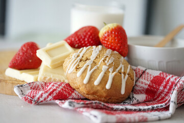 Vanilla and white chocolate cookie with strawberries on white background