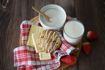 Vanilla and white chocolate cookie with strawberries on white background
