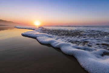 Scenic view of the sunrise on a sandy beach at van Stadens, South Africa