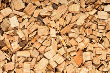 Pile of wood chips as background, top view. Wooden chips for smoking meat and fish.