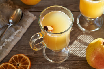 Hot pear drink on a wooden table