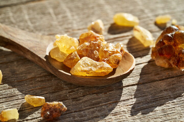 Frankincense resin on a spoon - ingredient for essential oil