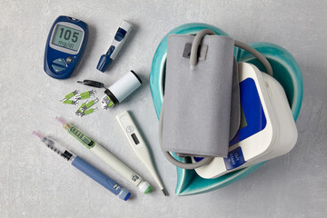 Glucose blood meter, insulin pen syringes and blood pressure monitor © OneBit