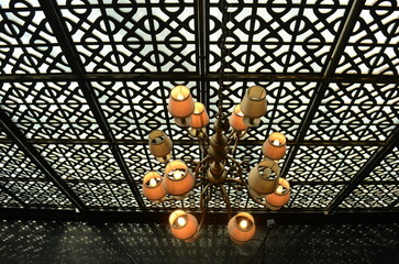 closeup, chandelier accessories in luxury room with room divider pattern background, selective focus