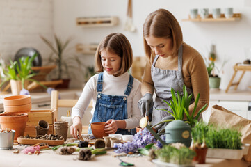 Mom and kid doing home gardening together