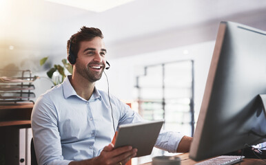 Hell find a way to help you no matter what. Shot of a young call centre agent working late in an...