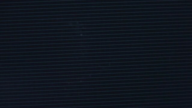 Close up view at a plasma tv while showing television activity.