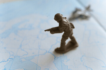Toy soldier on the background of the map Ukraine