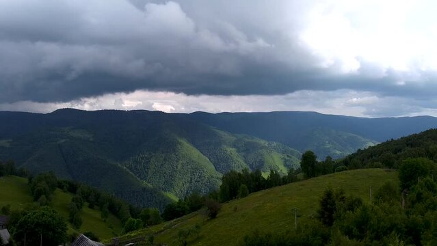 Dark clouds seen in the distance meaning a storm is coming in Apuseni Mountains.