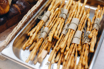 There are a lot of sticks on the silver plate.