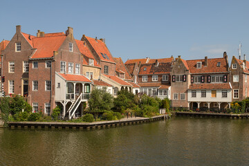 Fototapeta na wymiar Historic canal houses on the old harbor of the picturesque town of Enkhuizen in West Friesland.