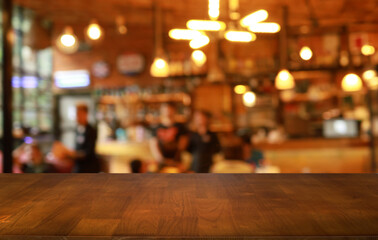 Empty wooden table in front of abstract blurred background of coffee shop . can be used for display or montage your products.Mock up for display of product