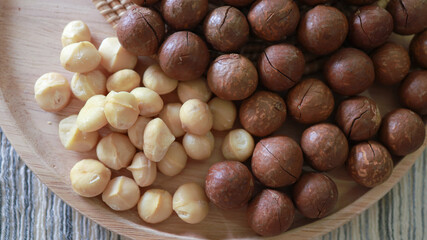 Organic Macadamia nut. macadamia nuts are cracked and baked to taste extremely delicious superfood fresh natural shelled unsalted raw macadamia and healthy food concept