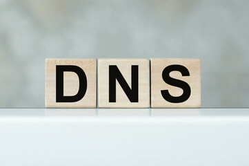 DNS - Acronym Domain Name System concept on cubes