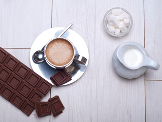 A bar of chocolate alongside hot coffee , Hot chocolate drink , hot chocolate , Tasty hot chocolate drink in small cup , Gourmet Hot Chocolate Milk , Homemade hot chocolate , hot chocolate