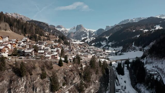 Drone shot towards small mountain church in the dolomites Italy