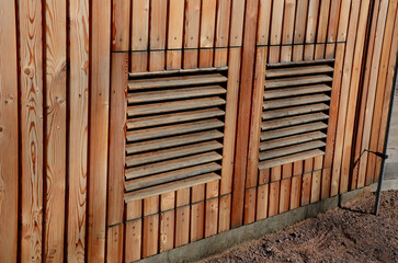 wooden shutters in the house are used for ventilation and cooling of the building. the view of the house resembles a cottage. modern eco friendly facade architecture