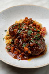 Lentils osso buco with braised beef and thick sauce, appetizing menu photo