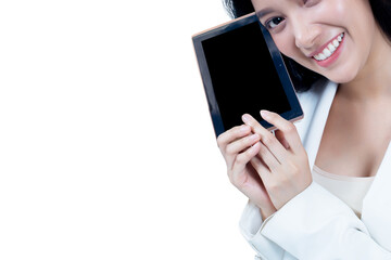 Portrait of a happy Asian woman holding a tablet with a smile on isolated white background