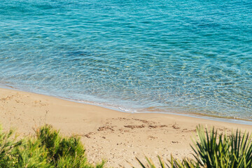 Crystal clear water in Cala Vidre located in the town of Ametlla de Mar, Tarragona, Costa Dorada, Spain.