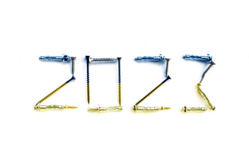 2023 lined with screws. The colors of the Ukrainian flag on the numbers. New Year 