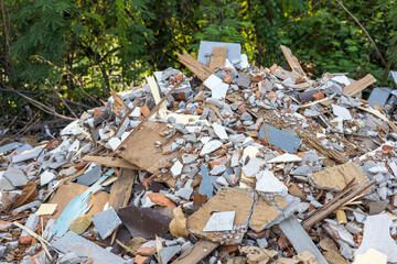Close-up view of concrete rubble, bricks and small pieces of wood.