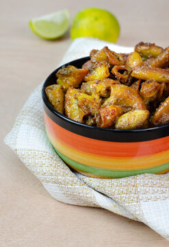 Close-up shot of a traditional Colombian dish of Chunchules in colorful bowl on a table napkin