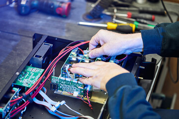 Repairing Hardware Equipment. Repair Shop and Worker with Tools.  Microchip and Circuit Board....