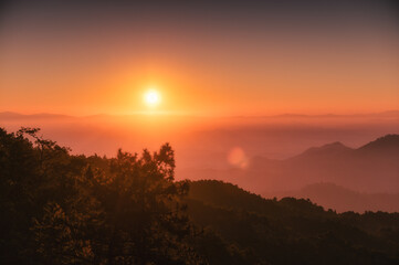 Sunrise over mountain with colorful sky in tropical rainforest at national park in the morning