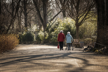 Two woman walking in a park