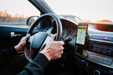 Gps car map system. Global positioning system on smartphone screen in auto car on travel road....