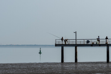 Fishermen on the Tagus River in Lisbon, Portugal