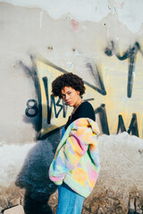 Obraz premium Portrait young mixed race curly hair woman posing outdoor