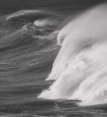 Grayscale shot of stormy sea waves with foam © Kernowbeach/Wirestock Creators