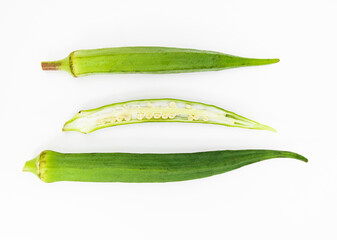 fresh slices and whole of okra or Lady Finger over on white background, top view