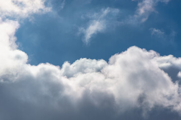 Fototapeta na wymiar White and dark cotton clouds in the blue sky.