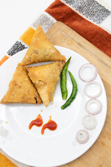 deep fry Samosa with chili and onion isolated on white background,