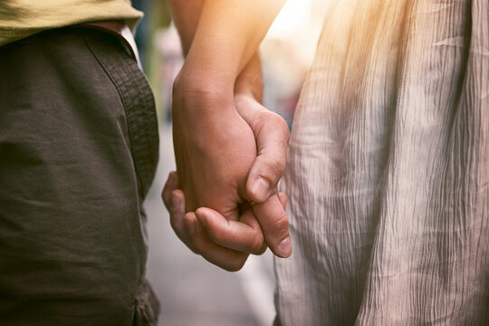 My hand will always have room for your hand. Cropped shot of an affectionate couple holding hands outdoors.