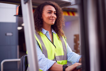 Female Worker Operating Fork Lift Truck At Freight Haulage Business © Monkey Business