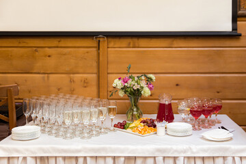 beautifully set tables with glasses and appliances for a wedding or other event